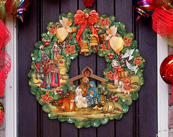 May include: A Christmas wreath with a nativity scene in the center. The wreath is decorated with red berries, green leaves, and white doves. There are angels on either side of the nativity scene, and the scene includes Mary, Joseph, baby Jesus, a donkey, a cow, and a shepherd.