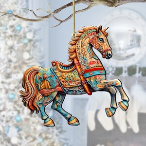 May include: A colorful wooden carousel horse ornament with intricate details and a gold-colored mane and tail. The horse is painted in shades of blue, green, gold, and red, and has a saddle and bridle.