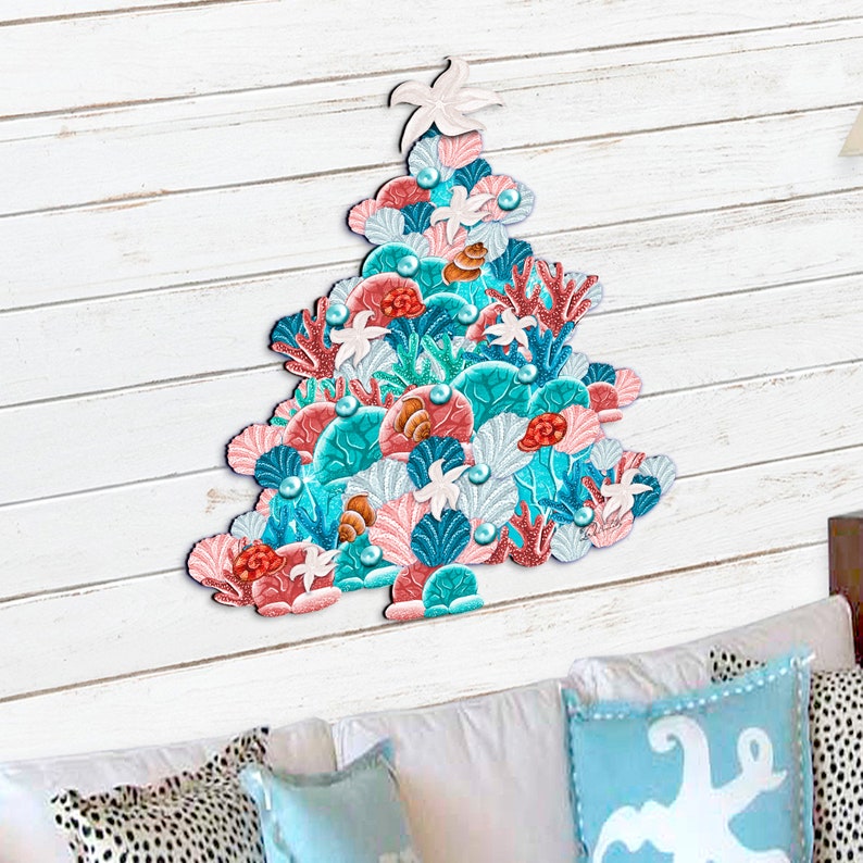 May include: A colorful Christmas tree decoration made of seashells, coral, and starfish. The tree is decorated with pearls and has a pink and blue color scheme.