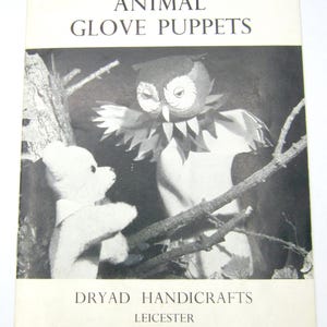 May include: Monochrome image of a vintage book cover. The title reads "ANIMAL GLOVE PUPPETS." It depicts an owl and teddy bear glove puppets. The text "DRYAD HANDICRAFTS LEICESTER" is printed below the image.