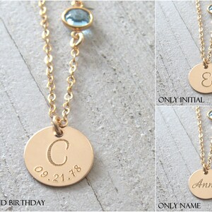 May include: Three gold necklaces with different charms. The first necklace has a round charm with the letter "C" and the date "09.21.78" engraved on it. The second necklace has a round charm with the letter "E" engraved on it. The third necklace has a round charm with the word "Anna" engraved on it.