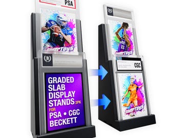 May include: Two black tiered display stands for graded trading card slabs. The stands feature clear acrylic fronts and hold slabs labelled PSA, CGC, and Beckett. A purple sign reads GRADED SLAB DISPLAY STANDS 2PK FOR PSA CGC BECKETT.