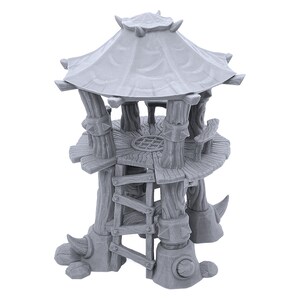 May include: A gray, wooden tower with a thatched roof and a ladder leading to the top. The tower is built on four legs that resemble animal feet.
