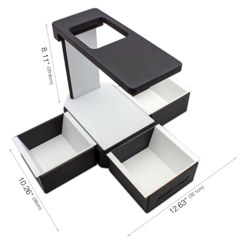 May include: A black and white desk organizer with four drawers and a top shelf. The organizer is 12.63 inches (32.1cm) wide, 10.26 inches (26cm) deep, and 8.11 inches (20.6cm) tall. The drawers and top shelf are black, while the supporting structure is white.