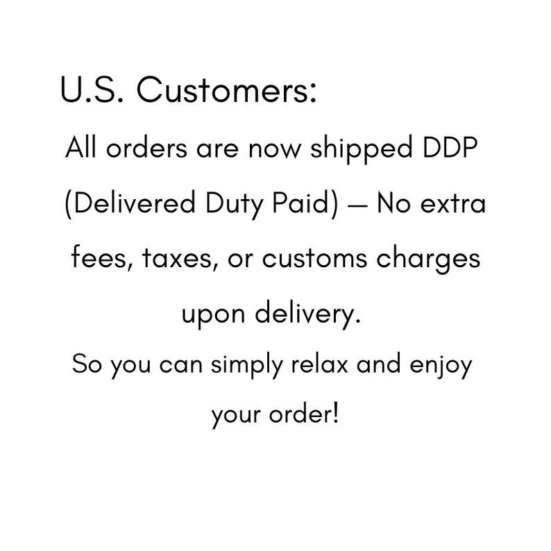 May include: A white rectangular sign with black text that reads: U.S. Customers: All orders are now shipped DDP (Delivered Duty Paid) &mdash; No extra fees, taxes, or customs charges upon delivery. So you can simply relax and enjoy your order!