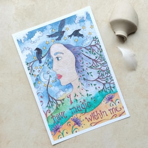 May include: A watercolour art print depicting a woman's profile with hair merging into branches and leaves. The image includes crows, stars, and the text "I have magic within me." The colour scheme features blues, greens, and purples.