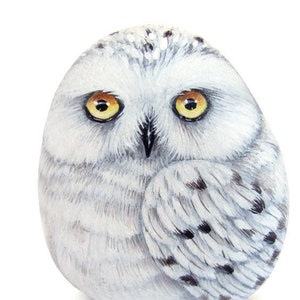 Rock painted snowy owl