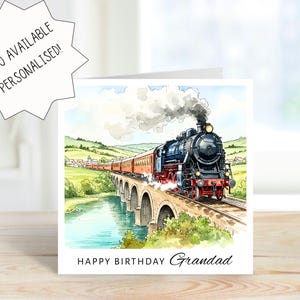 May include: A square greeting card featuring a watercolor illustration of a black steam locomotive pulling red passenger cars across a stone viaduct over a river. The text reads "ALSO AVAILABLE PERSONALISED!" and "HAPPY BIRTHDAY Grandad".