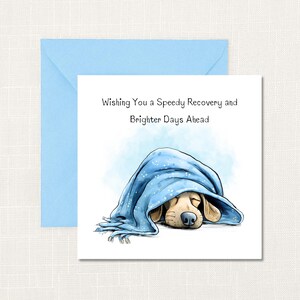 May include: A get-well card showing a cartoon dog sleeping under a blue blanket. The card reads "Wishing You a Speedy Recovery and Brighter Days Ahead." A light blue envelope is also included.
