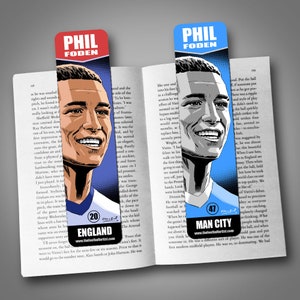 May include: Two illustrated bookmarks featuring portraits of Phil Foden, a professional soccer player. The bookmarks are blue and light blue with the text "Phil Foden" and the player's jersey number. The left bookmark has the text "England" and "20" on it. The right bookmark has the text "Man City" and "47" on it.