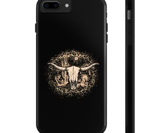 May include: Black phone case with a white bull skull graphic against a brown leopard print background.