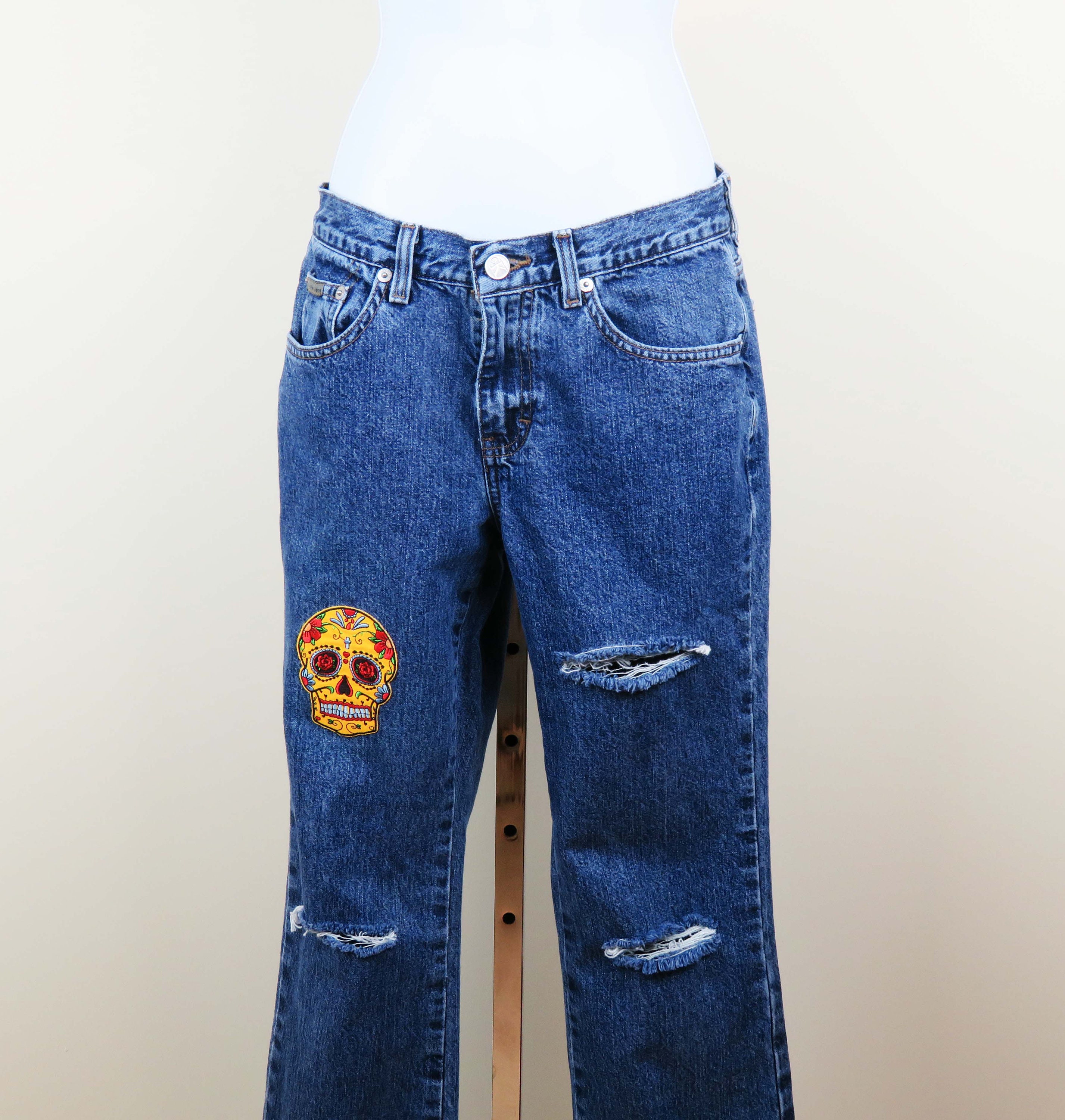 Ripped Upcycled Jeans With Yellow Sugar Skull Patch