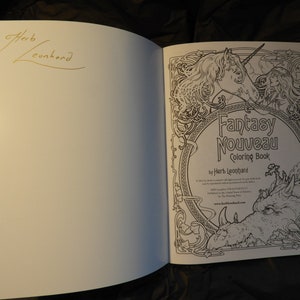 May include: A black and white colouring book with a unicorn and dragon on the cover. The title is "Fantasy Nouveau Coloring Book" by Herb Leonard.