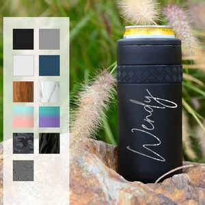 May include: Black insulated can cooler with a diamond pattern and the name "Wendy" engraved on the side.