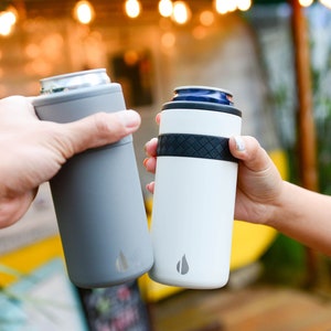 May include: Two people clinking insulated beverage holders, one gray and one white, with a black band and a logo of a water drop.