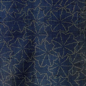 May include: A dark blue fabric with a white pattern of stylized leaves. The fabric has a textured woven appearance.