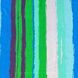 May include: Abstract striped fabric with blue, green, purple, and white brushstrokes. The fabric has a textured, woven appearance.