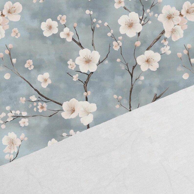 May include: A seamless pattern featuring delicate white cherry blossoms on a light blue background. The blossoms are arranged in a repeating pattern, creating a soft and romantic feel.