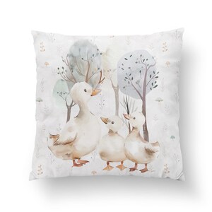 May include: A watercolor illustration of three ducks in a forest setting. The ducks are white with brown accents and are surrounded by trees and foliage. The background is a light gray with a subtle pattern.