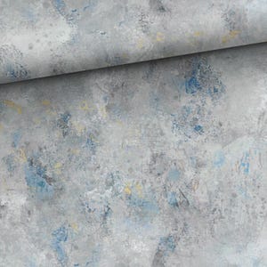 May include: Abstract art fabric with a gray, blue, and yellow color palette. The fabric has a textured appearance with brushstroke-like patterns. The design features a blend of cool and warm tones, creating a modern aesthetic.