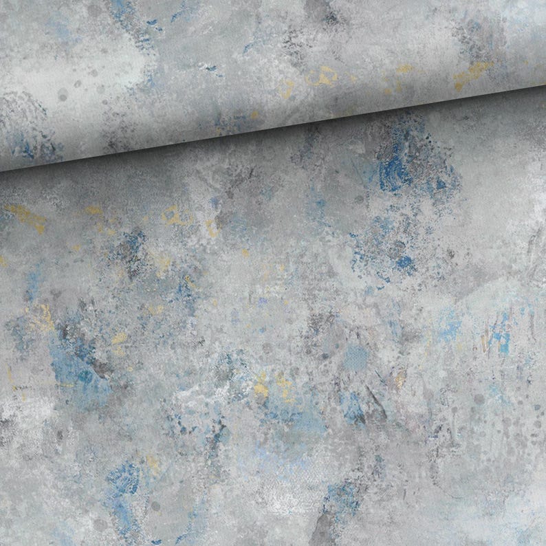 May include: Abstract art fabric with a gray, blue, and yellow color palette. The fabric has a textured appearance with brushstroke-like patterns. The design features a blend of cool and warm tones, creating a modern aesthetic.