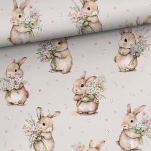 May include: A seamless pattern featuring a repeating design of cute bunnies holding bouquets of flowers. The bunnies are brown with white accents and are set against a light gray background with small pink hearts.