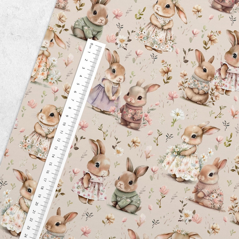 May include: A seamless pattern featuring a repeating design of cute bunnies wearing dresses and sweaters. The bunnies are surrounded by small pink and white flowers on a light beige background.
