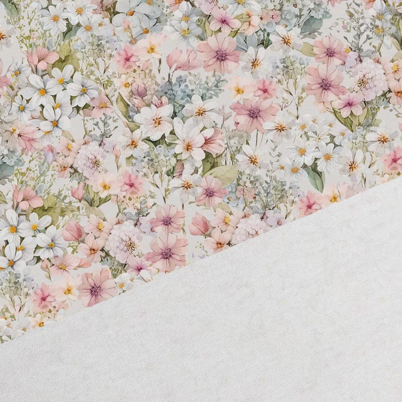 May include: A white fabric with a floral pattern featuring pink, white, and green flowers. The fabric has a soft, textured feel.