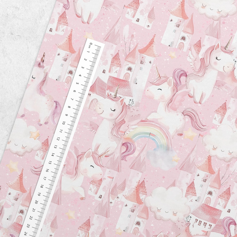 May include: A pink and white seamless pattern featuring unicorns, castles, clouds, and rainbows. The background is a light pink with a subtle sparkle effect.