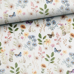 May include: A white fabric with a repeating pattern of blue, yellow, and pink flowers and butterflies. The background is white.