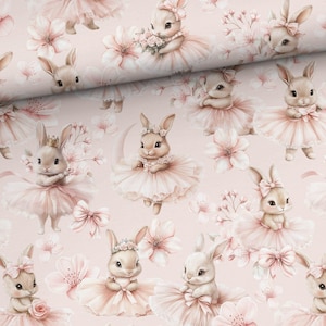 May include: A repeating pattern of adorable bunnies in pink tutus and floral crowns, surrounded by pink flowers and bows. The bunnies are in various poses, some holding bouquets, creating a whimsical and charming design. The background is a soft pink.