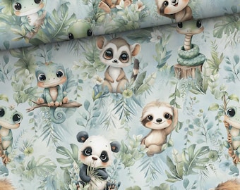 May include: A fabric print featuring a repeating pattern of cartoon animals including a frog, sloth, lemur, panda, and snake nestled among light green tropical leaves and foliage on a soft pale blue background with a whimsical illustrative style.
