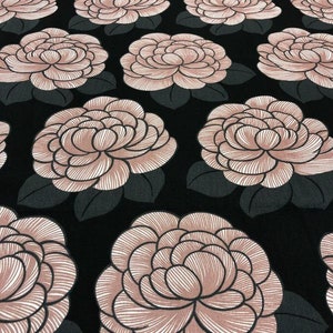 May include: Black fabric with a repeating pattern of large pink stylized flowers. The flowers have a white outline and are drawn with thin lines.