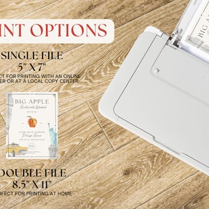 May include: A white printer with a paper tray open, showing a printed invitation with a red apple and the text "BIG APPLE" and "Bridal Shower". The invitation is for a 5x7 inch print or an 8.5x11 inch print.