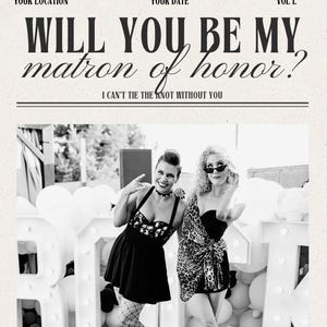 May include: Black and white photo of two women in front of a large white sign that says "ROCK". The woman on the left is wearing a black dress with a skull pattern and fishnet stockings. The woman on the right is wearing a black and brown animal print dress. The photo is in a newspaper style frame with the text "The Wedding Times" at the top and the text "Will you be my matron of honor? I can't tie the knot without you" in the middle.