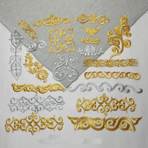 May include: A collection of gold and silver embroidered patches featuring intricate floral and geometric designs. The patches are ideal for adding a touch of elegance to clothing, bags, or home decor.