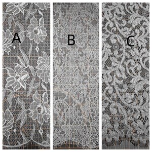 May include: Three panels of white lace fabric with different floral and ornamental patterns. Panel A features large flowers and leaves. Panel B has a dense, all-over floral design. Panel C displays a swirling, ornate pattern.