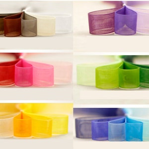 May include: Assortment of ten colors of sheer ribbon. The colors are black, brown, gray, beige, white, purple, red, pink, green, and blue.