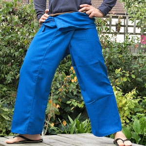 May include: Blue striped wrap pants with a wide waistband. The pants are made of a lightweight fabric and have a relaxed fit.