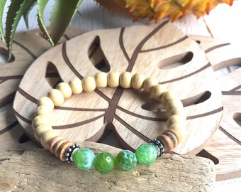 Bohemian style bracelet, light wooden beads, antique silver plated spacers, four faceted green gemstone beads, on elastic