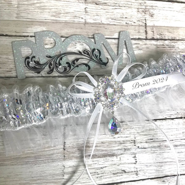 White iridescent prom garter.  Prom garter in white and iridescent sequin band and jewel.