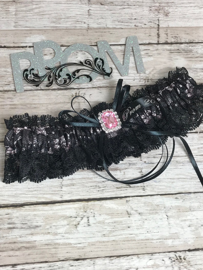 Prom garters. Black and pink prom garter with pink jewel