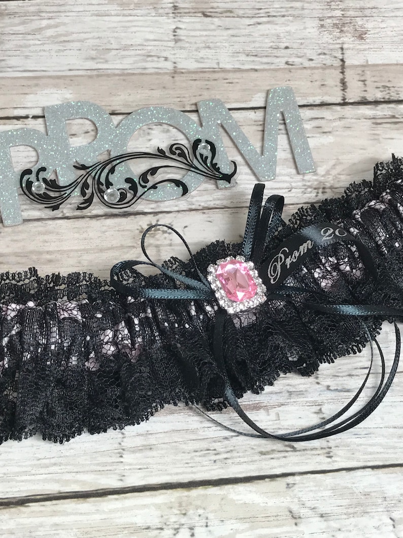 Prom garters. Black and pink prom garter with pink jewel