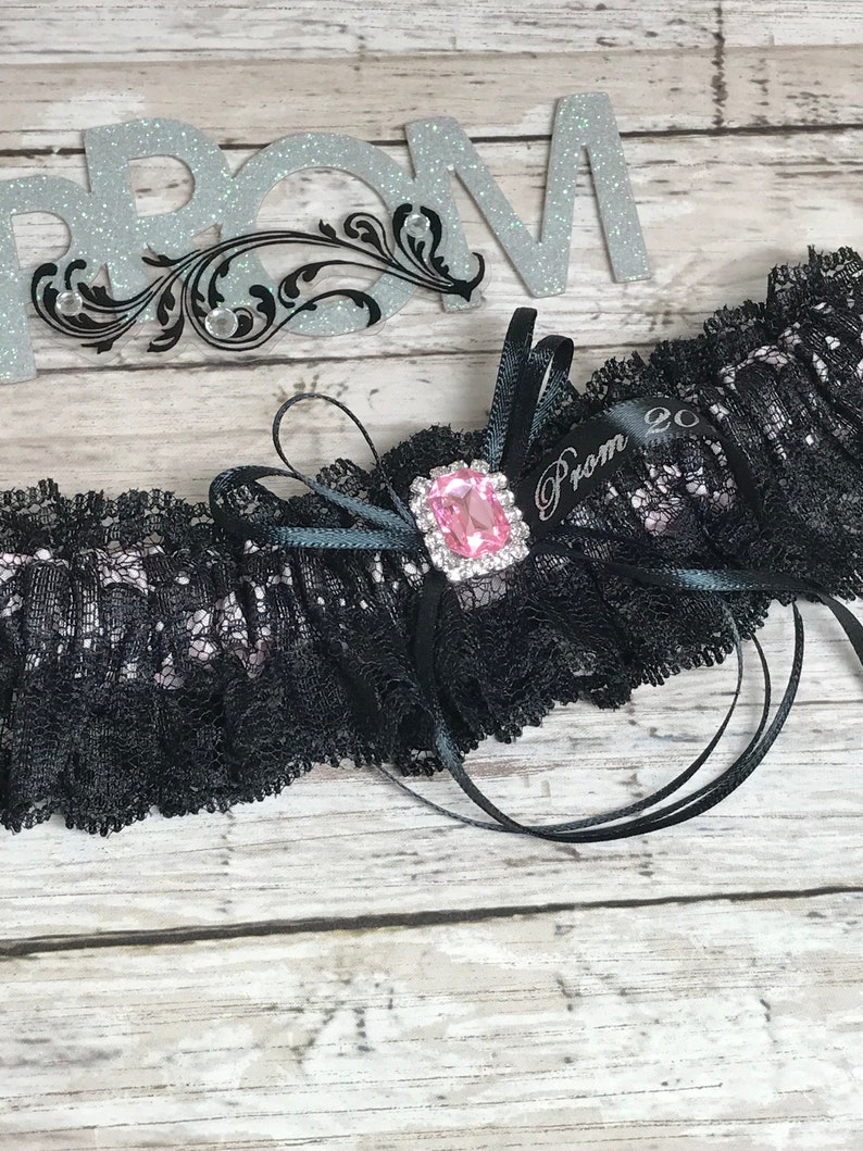 Prom garters. Black and pink prom garter with pink jewel