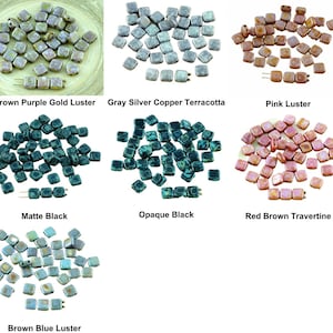 May include: Assortment of square ceramic tiles in various colors and finishes, including brown, purple, gold, gray, silver, copper, terracotta, pink, black, red, and blue. The tiles have a variety of textures, including matte, opaque, and luster.