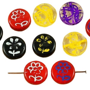 May include: Assortment of ten round glass beads with various floral designs. The beads are red, black, yellow, and purple with white and yellow accents.