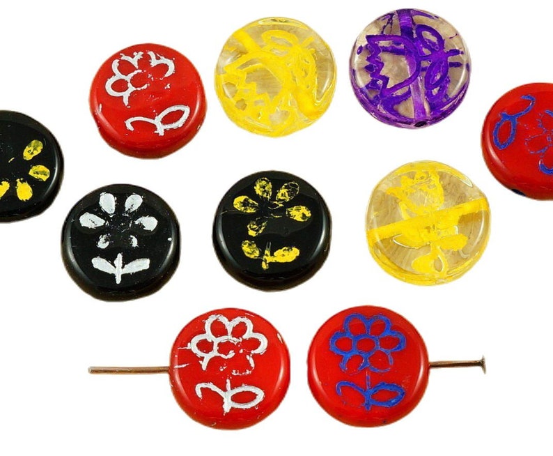 May include: Assortment of ten round glass beads with various floral designs. The beads are red, black, yellow, and purple with white and yellow accents.
