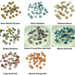 May include: Assortment of glass beads in various colors and finishes, including silver marble Picasso, silver rainbow, rainbow brown, golden rainbow, Sliperit purple blue gold half, Marea gold half, Capri gold half, and apricot orange half.
