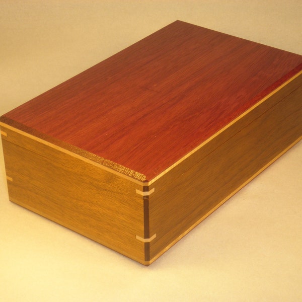 Fabulous Jewelry Box with bright Purple Heart lid surrounded by rich American Cherry sides and natural Curly Maple and Black Walnut interior