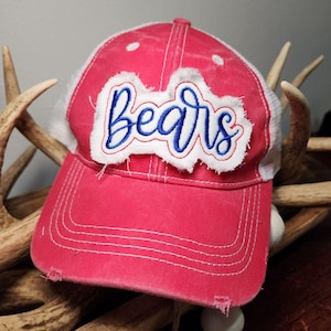 May include: A red and white trucker hat with a distressed white patch that says "Bears" in blue embroidery.